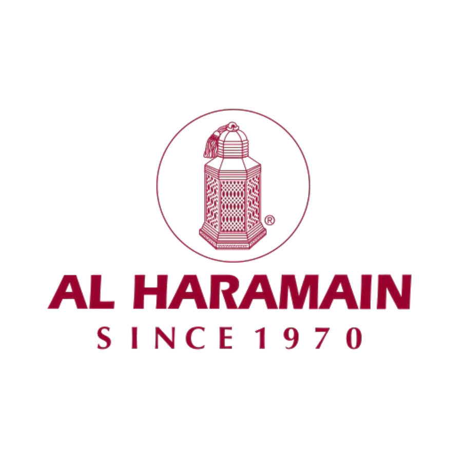 The Al Haramain logo features the brand name written in elegant, stylized Arabic calligraphy. The logo is predominantly black, with intricate golden accents and a distinctive circular motif surrounding the text.