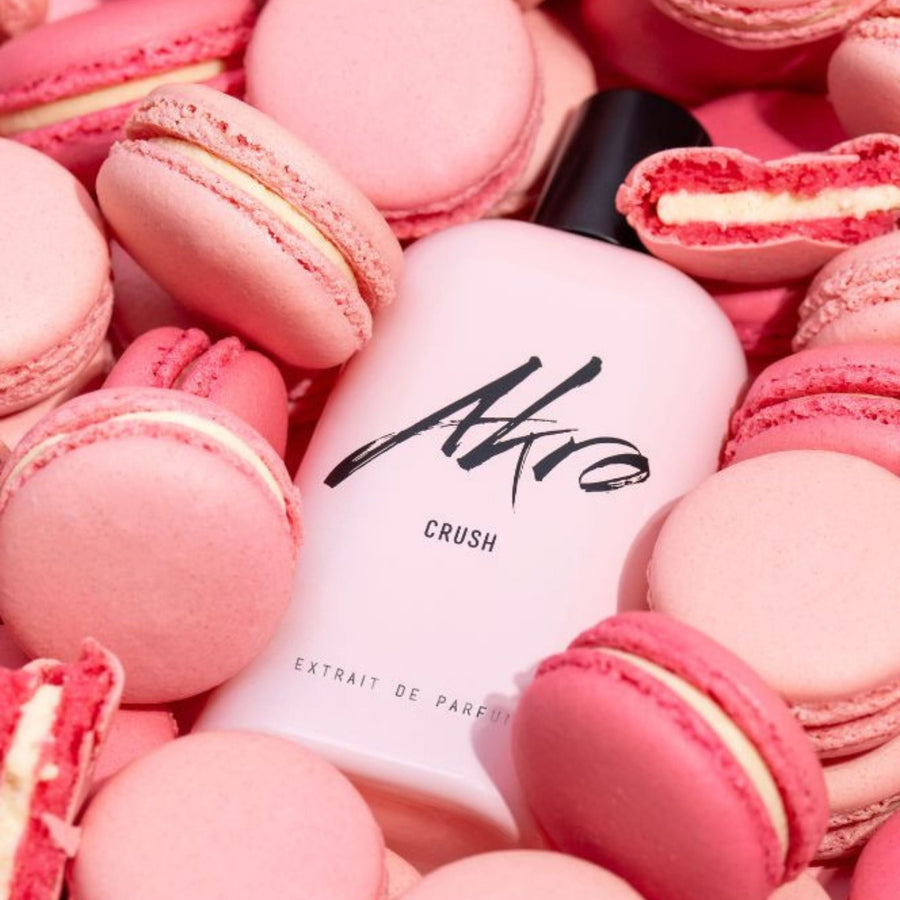 Akro Crush perfume bottle by Akro in soft pink packaging, inspired by a rose macaron gourmand fragrance