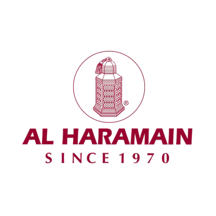 The Al Haramain logo features the brand name written in elegant, stylized Arabic calligraphy. The logo is predominantly black, with intricate golden accents and a distinctive circular motif surrounding the text. 